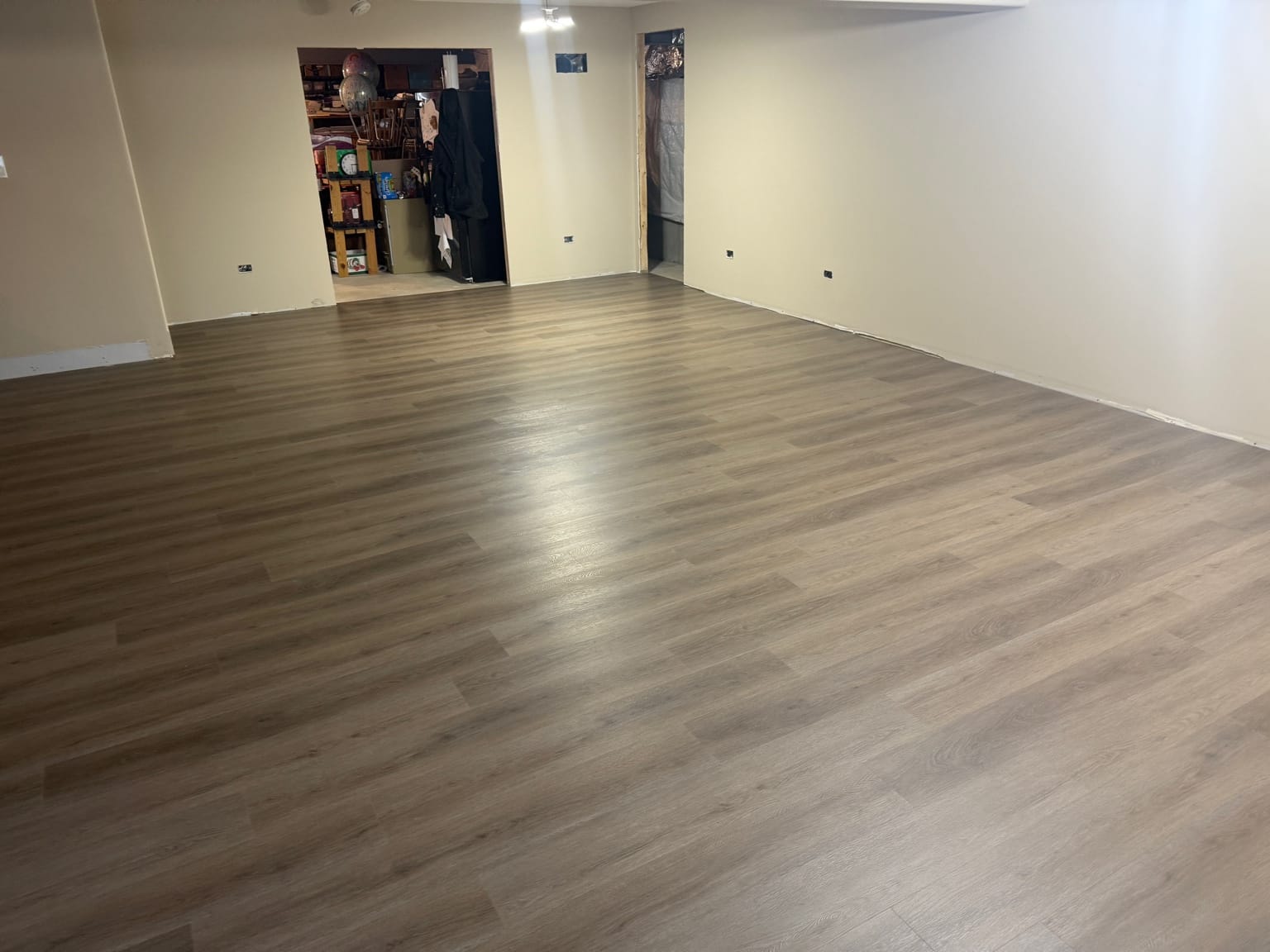 COREtec Eastwell Oak flooring installed in a Homer Glen basement in the Villas of Old Oak subdivision.