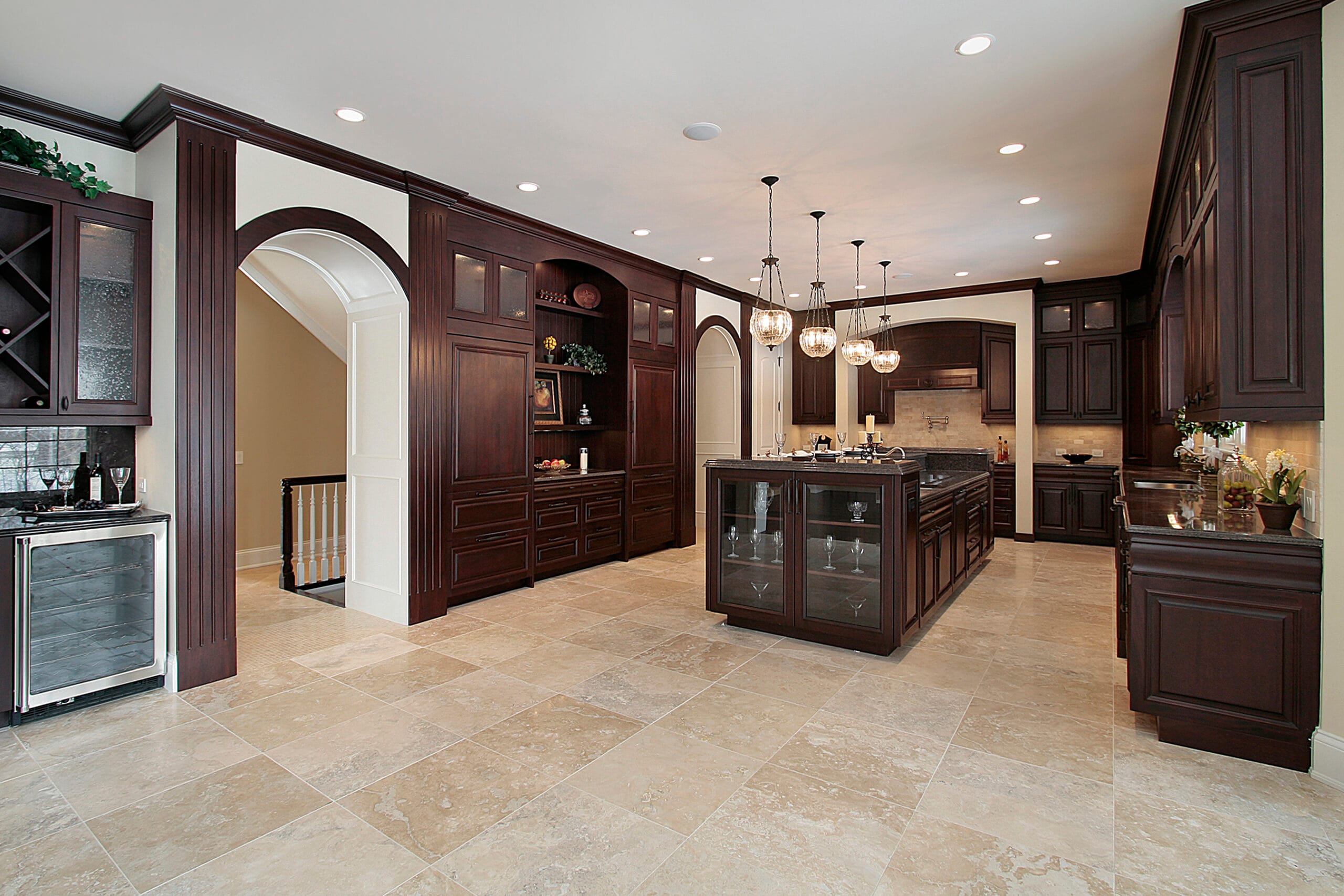 Kitchen with dark wood cabinetry and premium flooring installed by The Floor 4U in Mokena, IL. Rich tones and modern elegance in one seamless design.