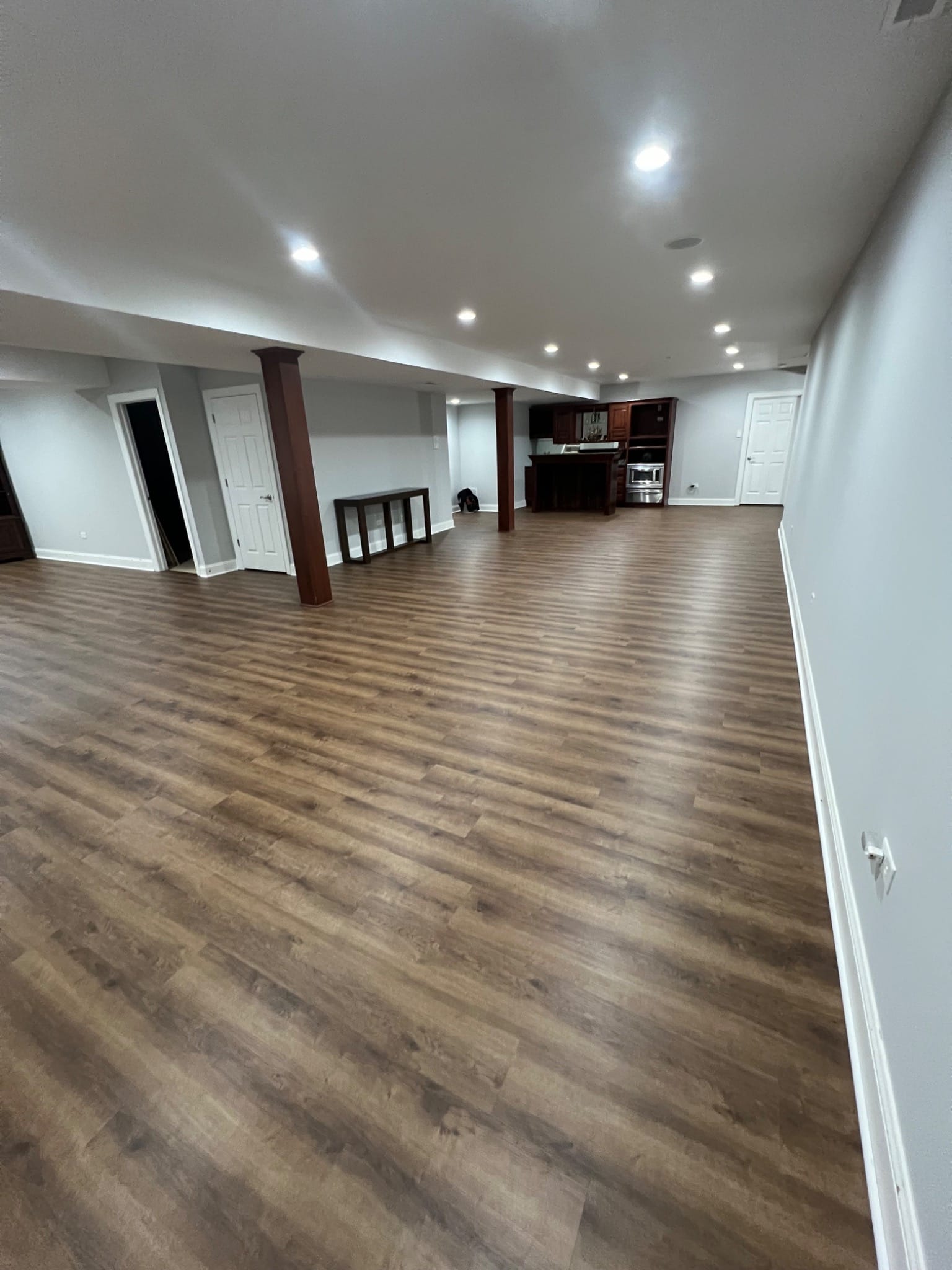 Basement luxury vinyl plank installation in Mokena, IL by The Floor 4 U. Durable, stylish, and perfect for large finished spaces.