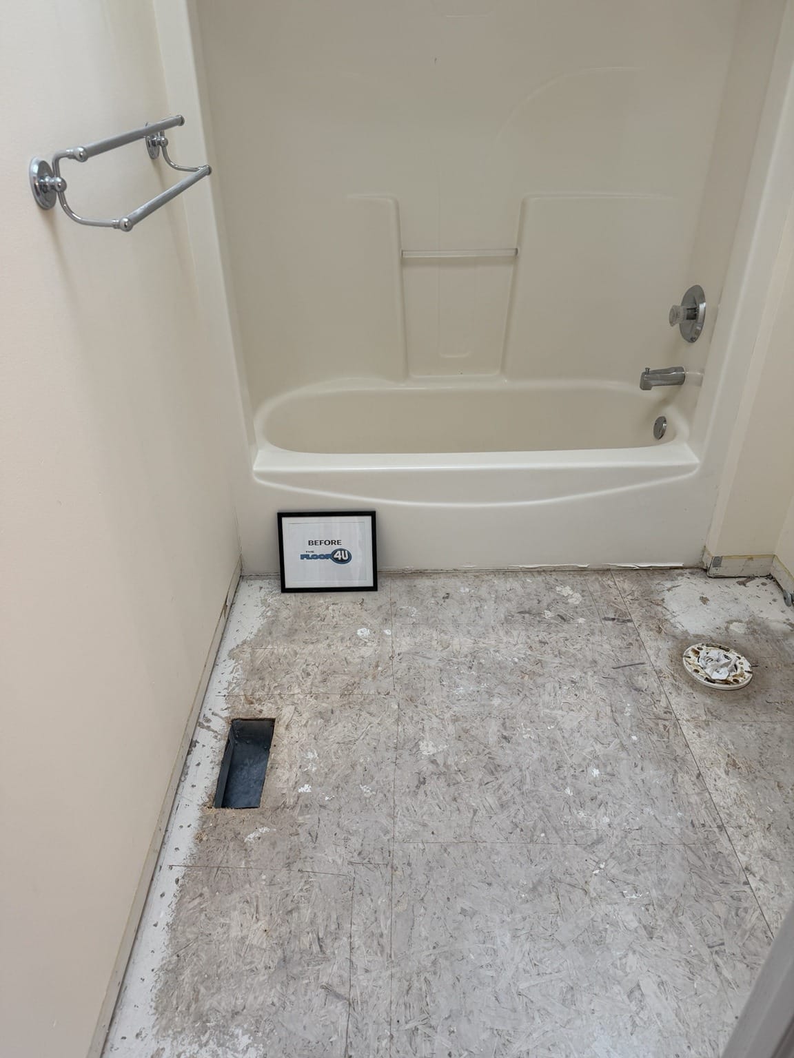 Bathroom subfloor exposed after the old floor came out, before new flooring, Manhattan, IL