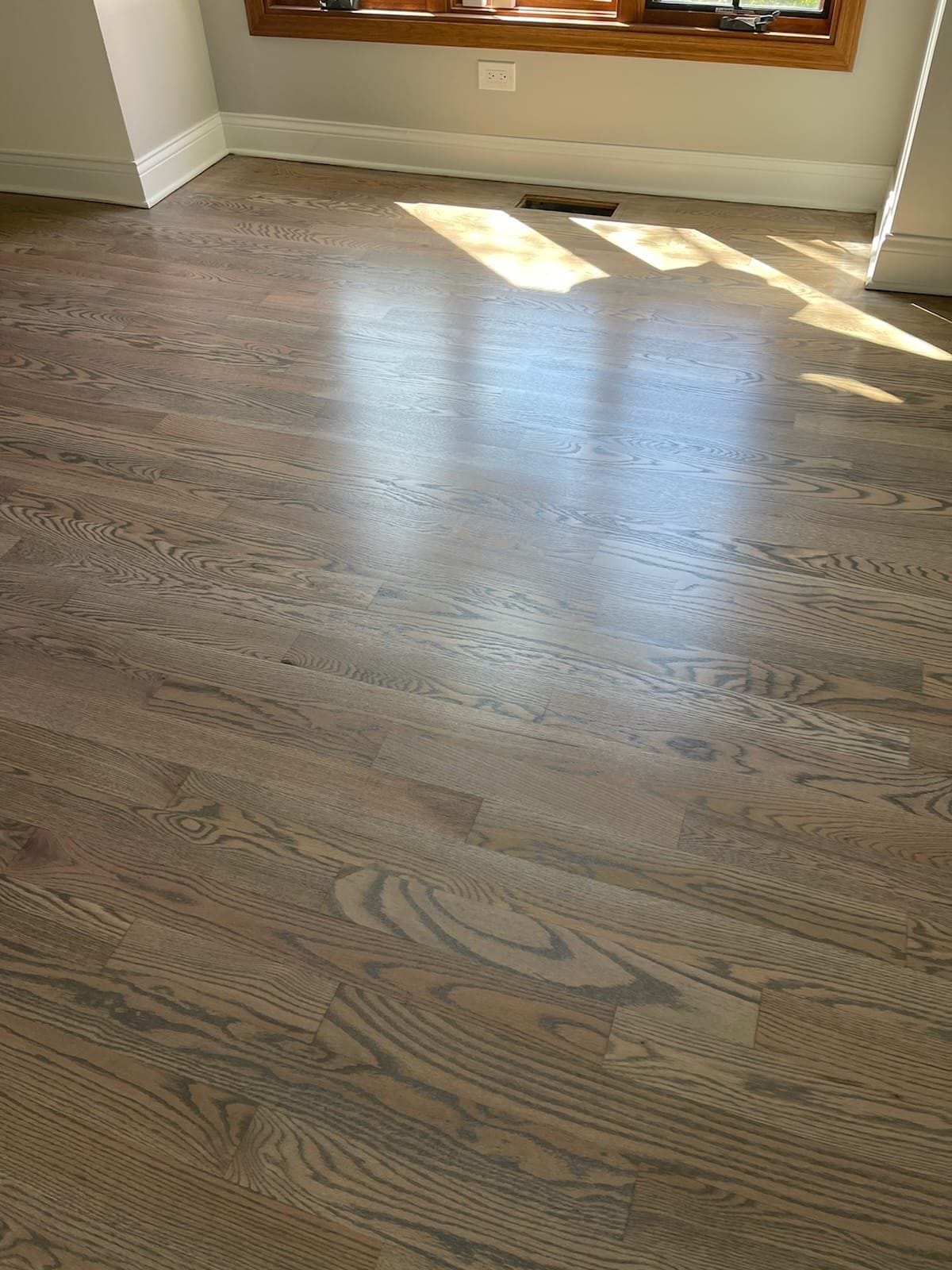 Hardwood floor in a Mokena IL home restored by sanding, staining, and sealing