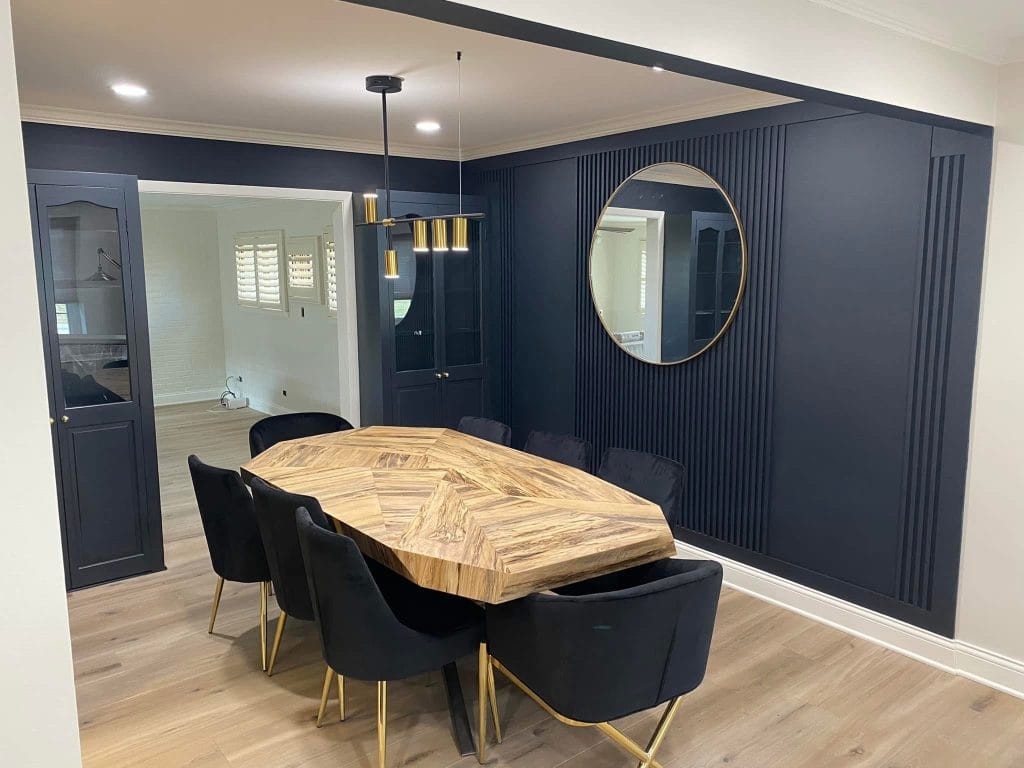 LVP flooring and trim wall paneling installed by The Floor 4 U in Orland Park, IL. Stylish dining room with bold design.