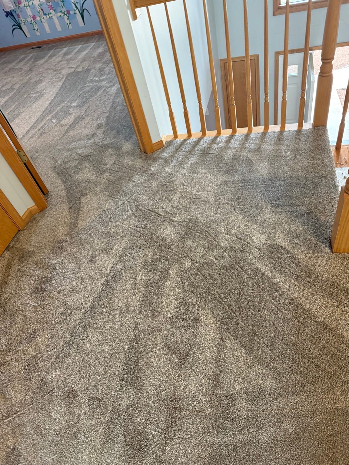 Stair landing carpet installation in a Mokena townhome with smooth transitions and professional finish.