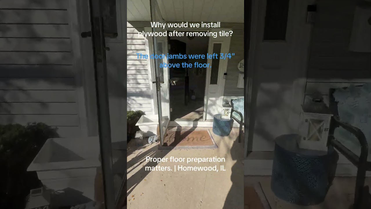 Home entrance with on-screen text explaining why plywood was installed after tile removal in Homewood.