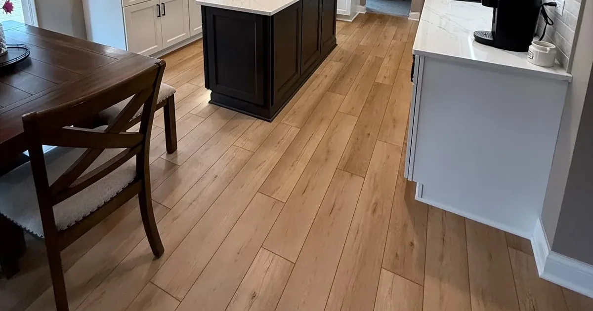 Wood-look luxury vinyl plank kitchen flooring installed by The Floor 4U in a Will County, IL home near Joliet