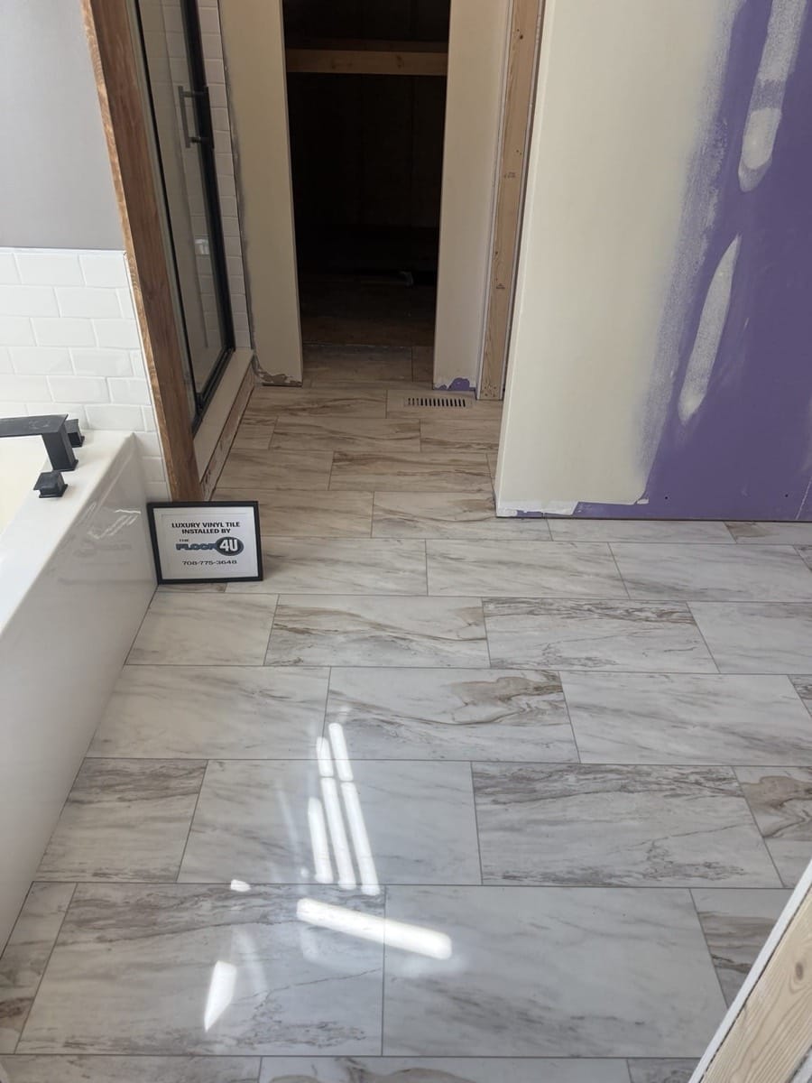 Waterproof COREtec Sonia Marble luxury vinyl plank flooring in a bathroom